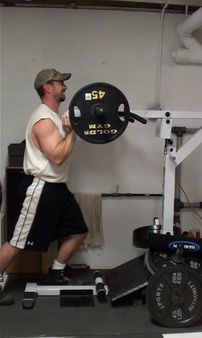 How to do the Shoulder Press on the Standing Calf Raise Machine