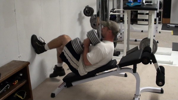 Set your feet on the wall for the Incline dumbbell bench press