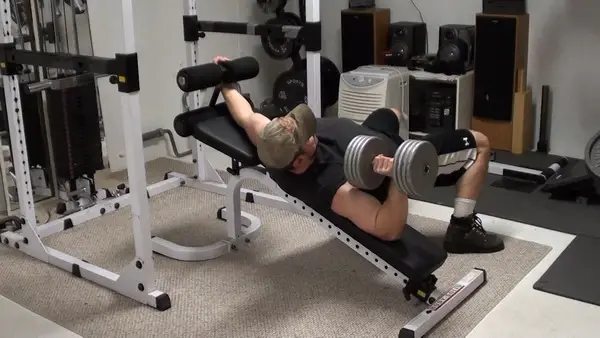 Work the inner pecs with tilted dumbbell bench press