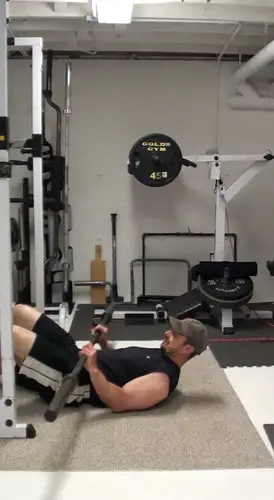 One-Arm Barbell Floor Press In Single-Leg Bridge Position